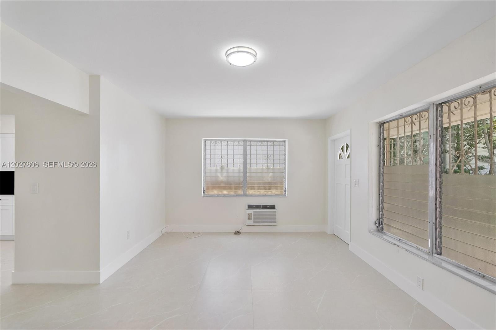1612 Southwest 23rd Street, Unit 1612 Miami, FL 33145 - Photo 9 of 42 a view of an empty room with a window