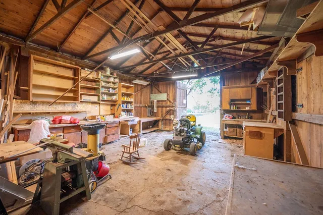 a backyard of a house with plants and tree s