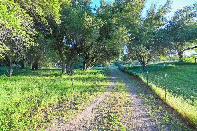 a kitchen with stainless steel appliances kitchen island a refrigerator and a stove