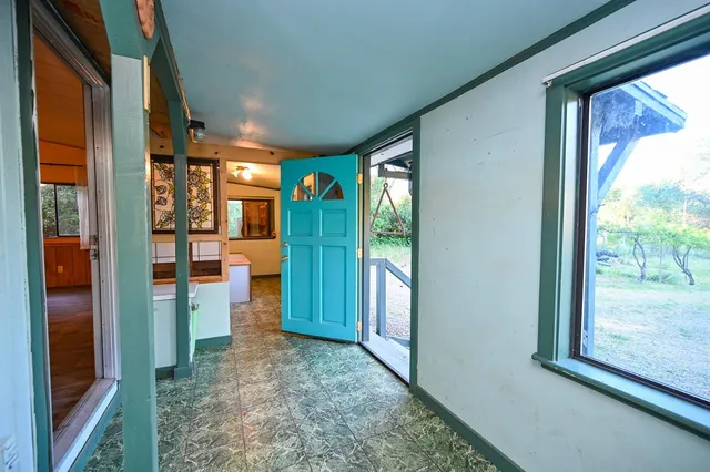 a bathroom with a granite countertop sink and a large mirror