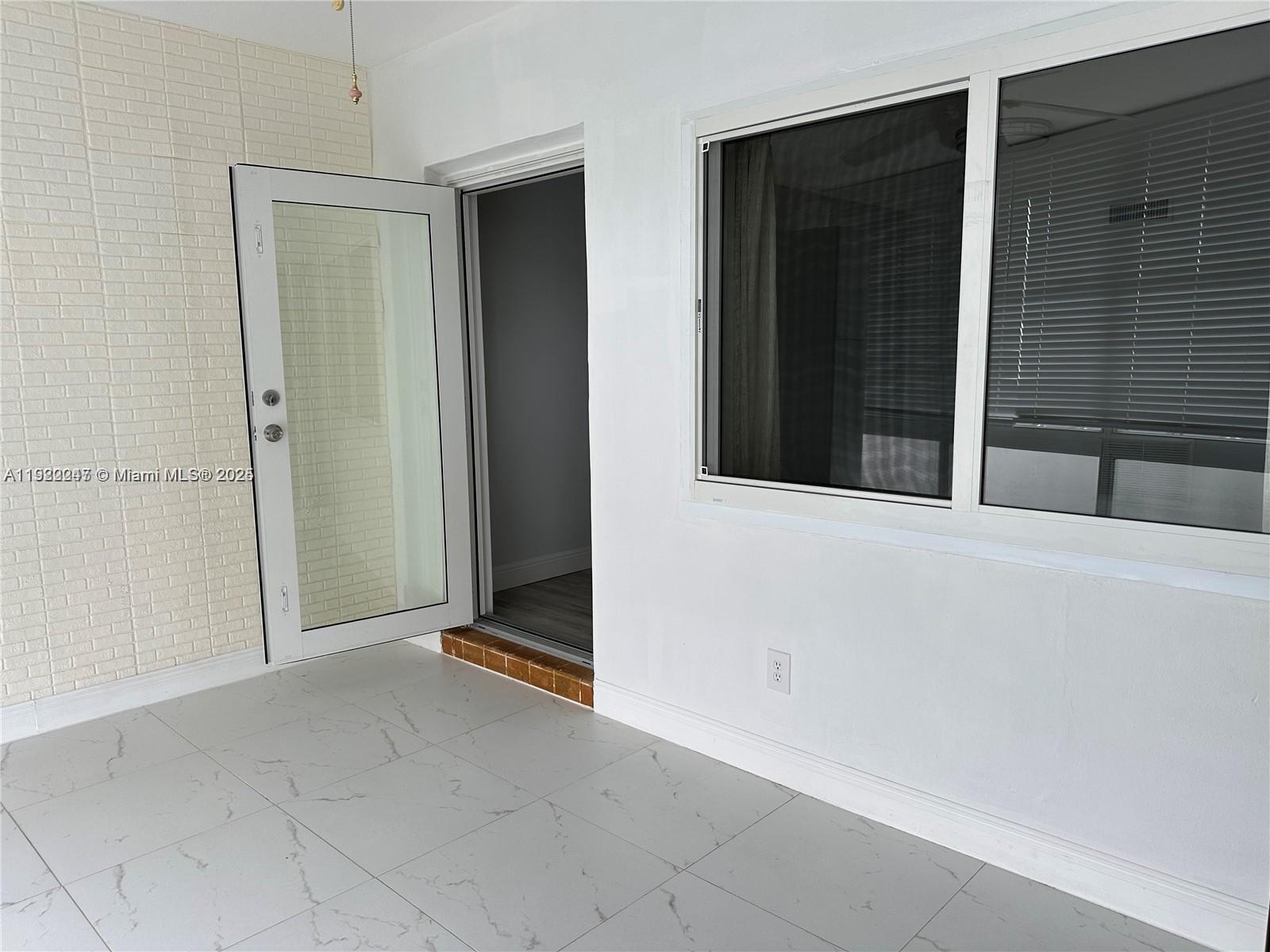 141 Northeast 10th Avenue, Unit 18B Hallandale Beach, FL 33009 - Photo 8 of 15 a view of an entrance of the house