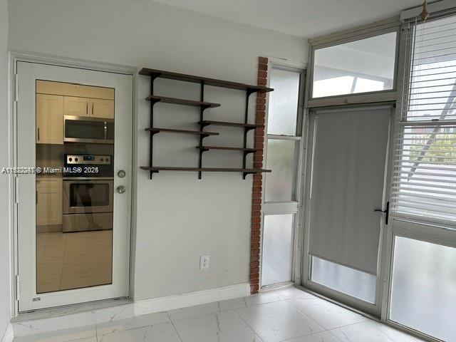 141 Northeast 10th Avenue, Unit 18B Hallandale Beach, FL 33009 - Photo 9 of 15 a view of a storage & utility room