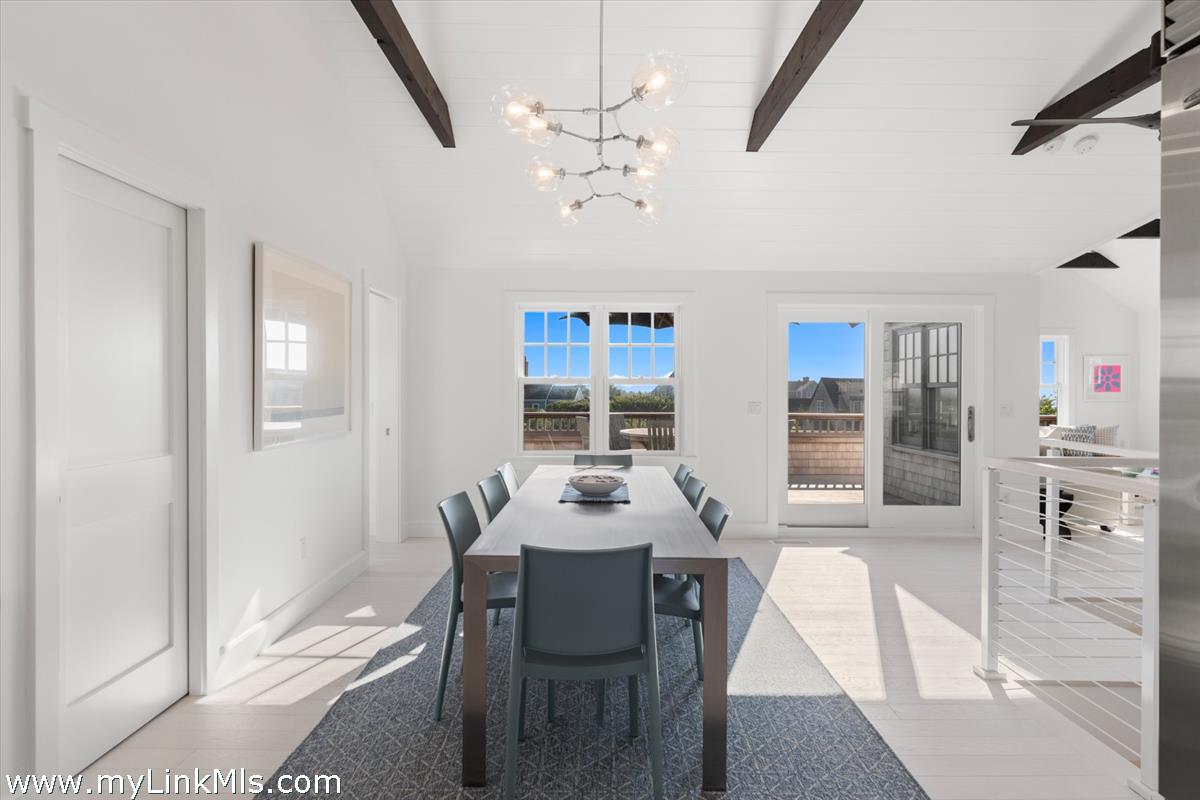 3 Tautemo Way Nantucket, MA 02554 - Photo 28 of 57 a dining room with furniture a chandelier and window