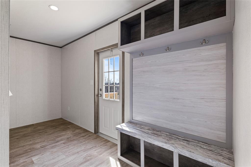 3888 Sandusky Road Whitesboro, TX 76273 - Photo 21 of 24 Mudroom featuring light wood-style/Washer Dryer room ornamental molding, and recessed lighting