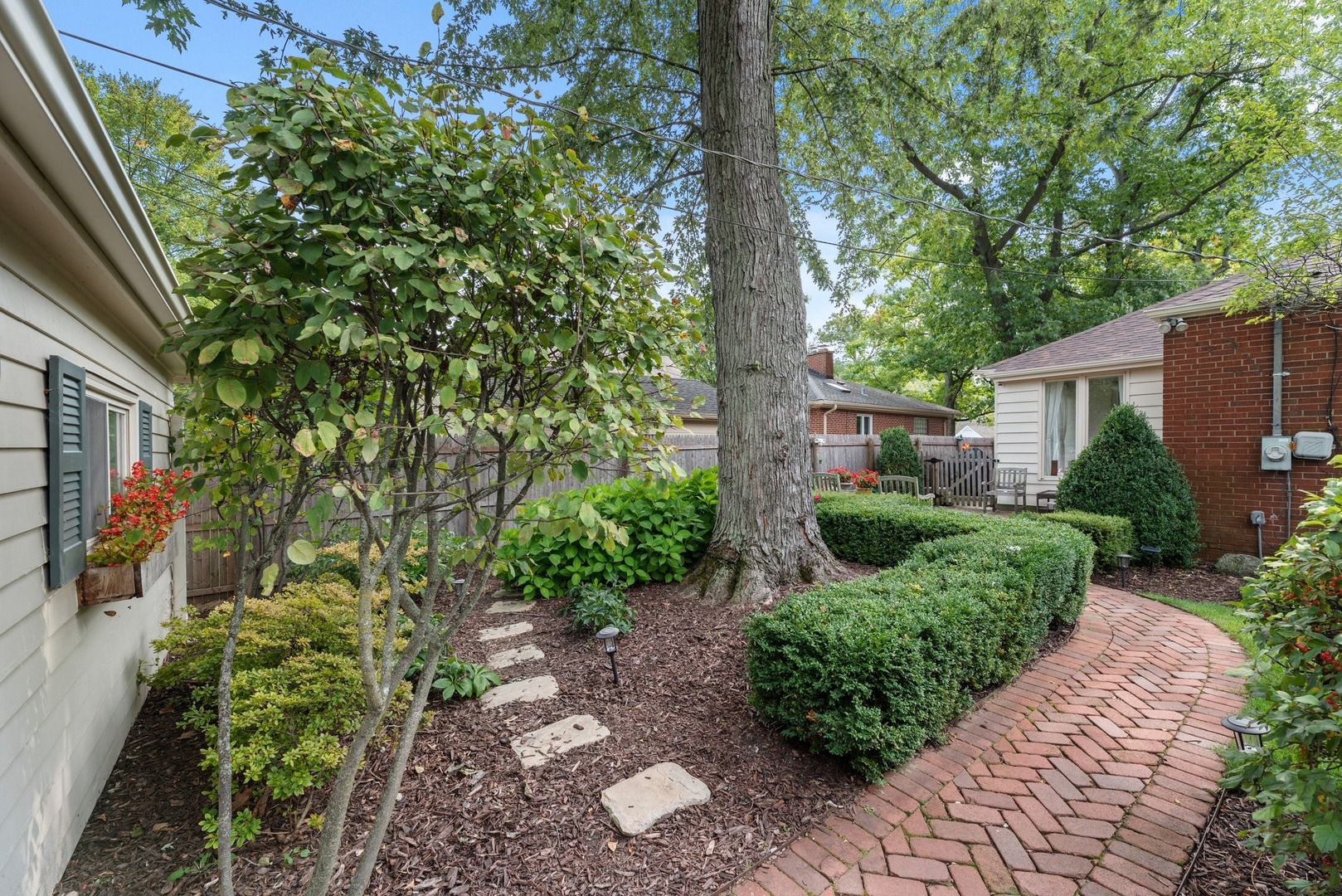 101 Winston Road Lake Forest, IL 60045 - Photo 22 of 26 a view of a garden with a tree