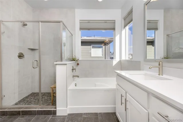 a bathroom with a sink a mirror and a bathtub