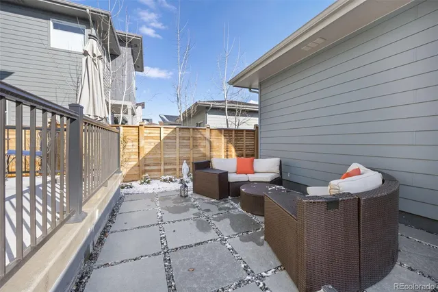 a view of a patio with table and chairs