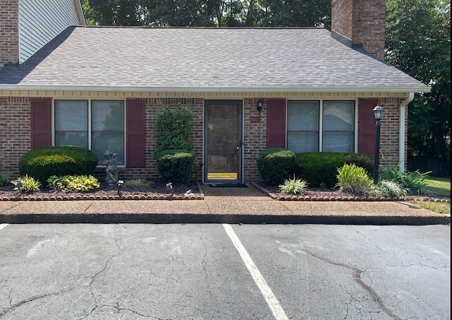 758 Kent Road Nashville, TN 37214 - Photo 1 of 21 a front view of a house with a yard and potted plants