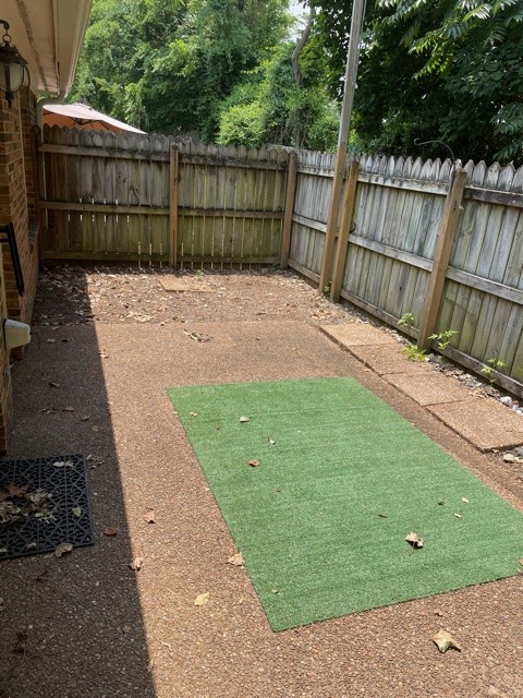 758 Kent Road Nashville, TN 37214 - Photo 18 of 21 a view of a backyard with a small cabin and wooden fence