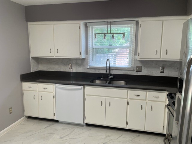 758 Kent Road Nashville, TN 37214 - Photo 4 of 21 a kitchen with white cabinets and a sink