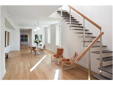 286 Spring Street, Unit PH Manhattan, NY 10013 - Photo 1 of 1 a living room with furniture and wooden floor
