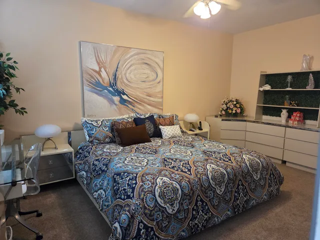 a bedroom with a bed and window