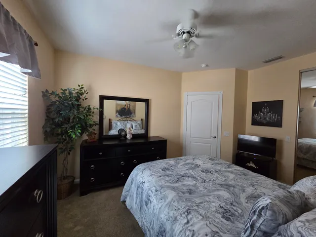 a bedroom with a bed and a dresser