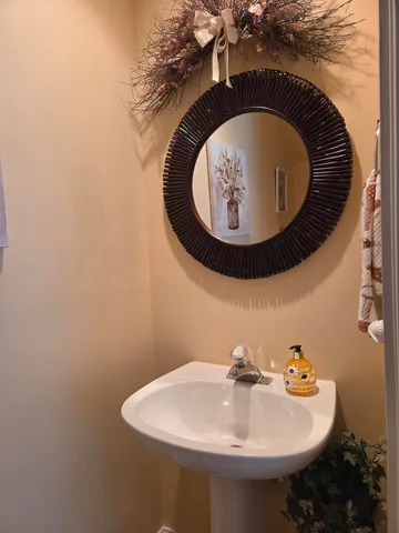 a bathroom with a sink and mirror