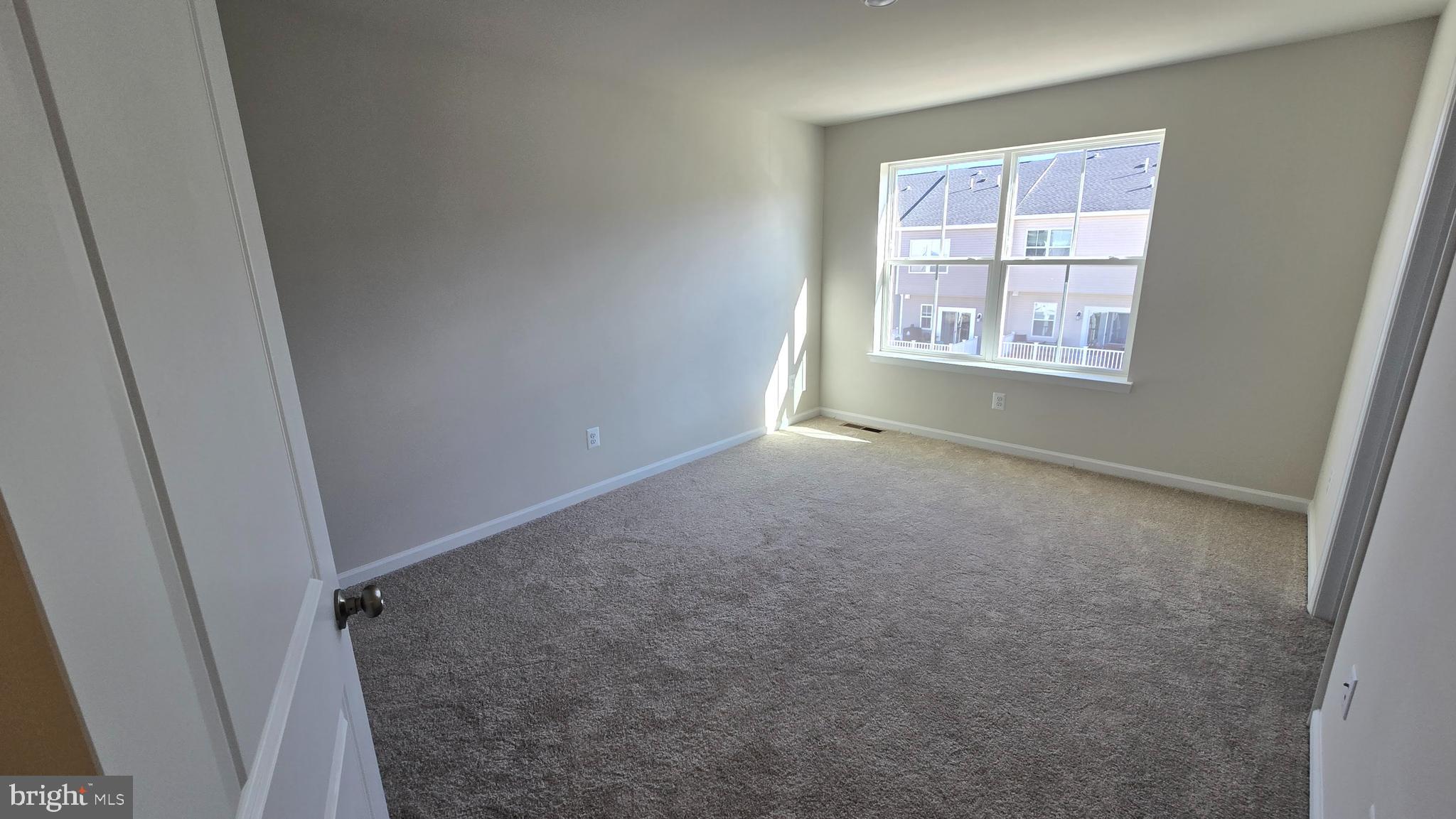 1344 Red Clover Lane Ranson, WV 25438 - Photo 20 of 31 an empty room with windows