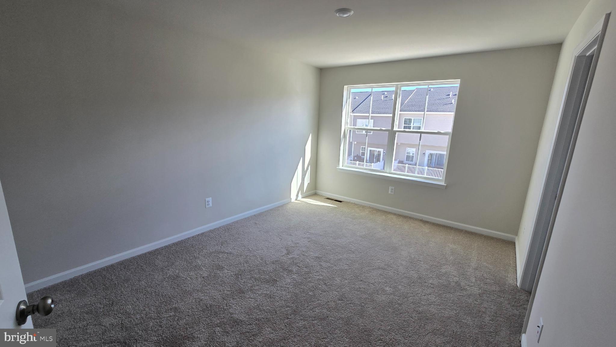 1344 Red Clover Lane Ranson, WV 25438 - Photo 21 of 31 an empty room with windows