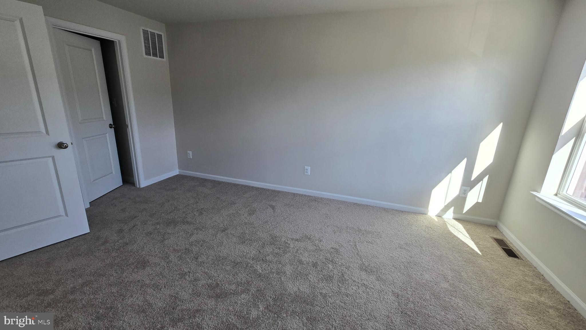 1344 Red Clover Lane Ranson, WV 25438 - Photo 23 of 31 an empty room with windows