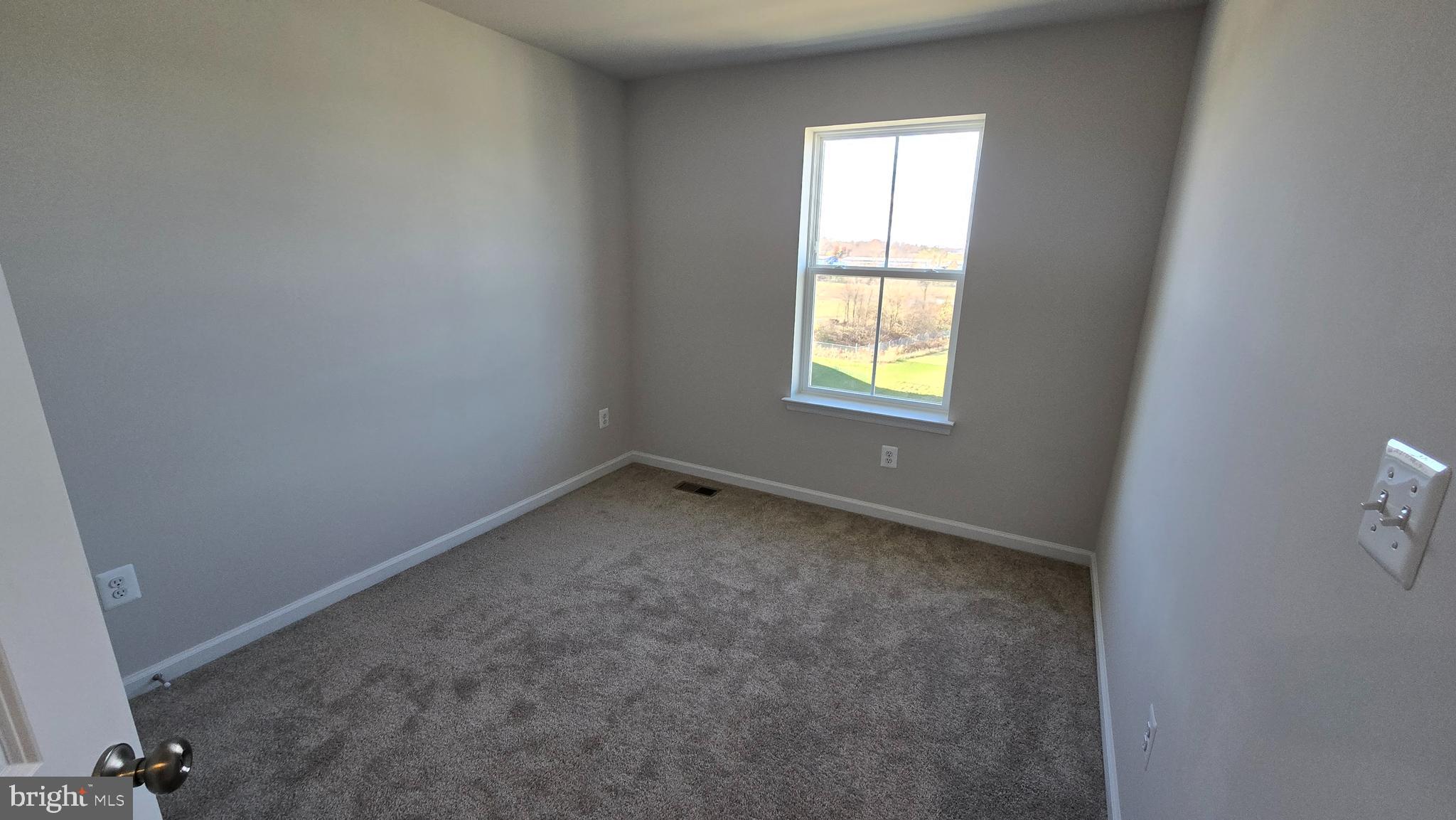 1344 Red Clover Lane Ranson, WV 25438 - Photo 24 of 31 an empty room with a window