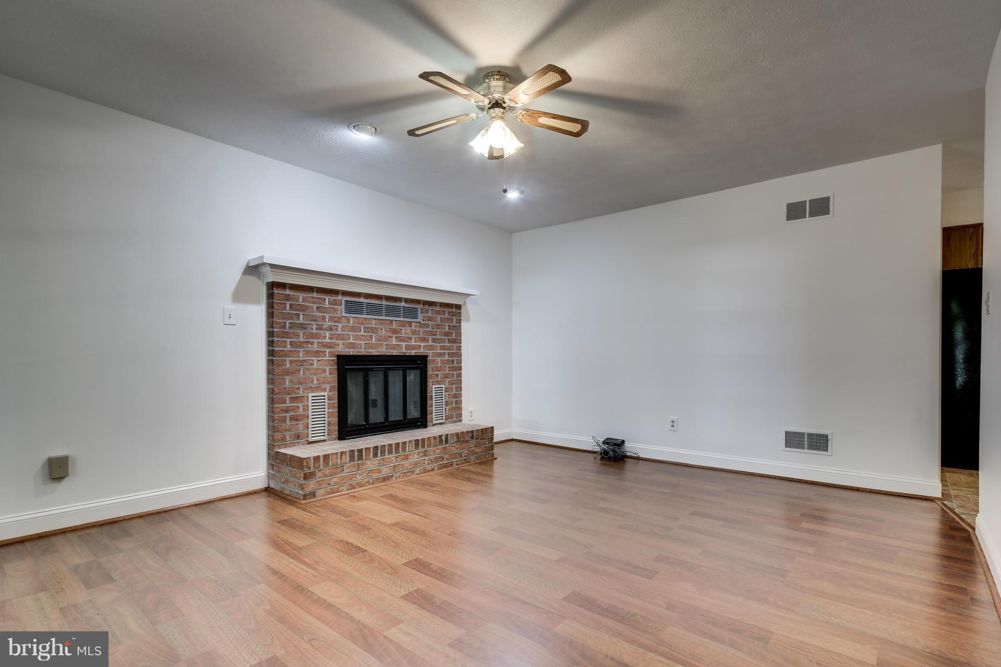 695 Streaker Road Sykesville, MD 21784 - Photo 12 of 24 Family Room w/ wood-burning FP