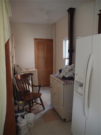 39 Avon Street Somerville, MA 02143 - Photo 14 of 16 a storage room with washer and dryer