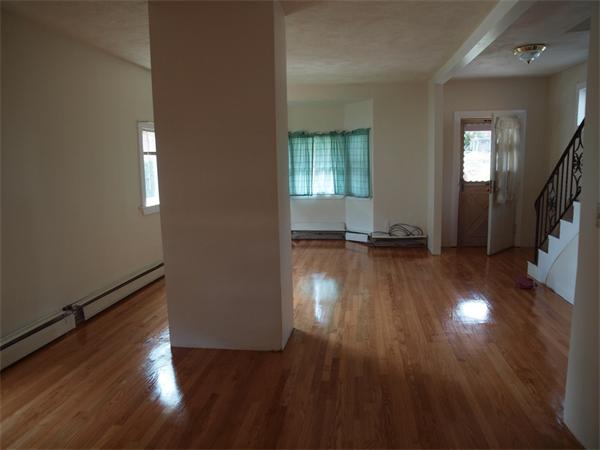 39 Avon Street Somerville, MA 02143 - Photo 16 of 16 wooden floor in an empty room with a window