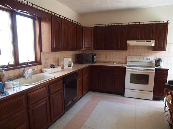 39 Avon Street Somerville, MA 02143 - Photo 5 of 16 a kitchen with a sink a stove and cabinets