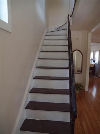 39 Avon Street Somerville, MA 02143 - Photo 8 of 16 a view of entryway with wooden floor and stairs