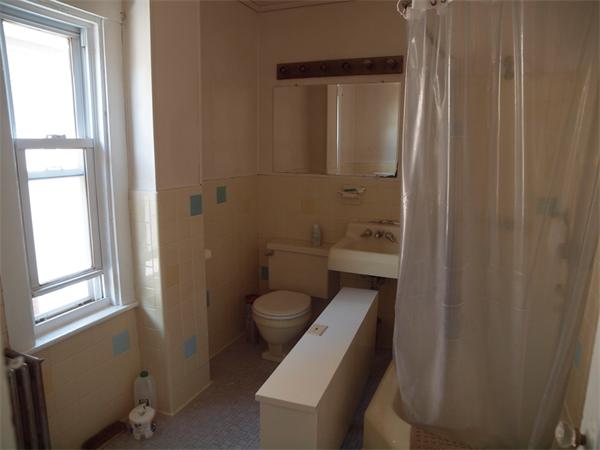 39 Avon Street Somerville, MA 02143 - Photo 9 of 16 a bathroom with a toilet a sink and tub