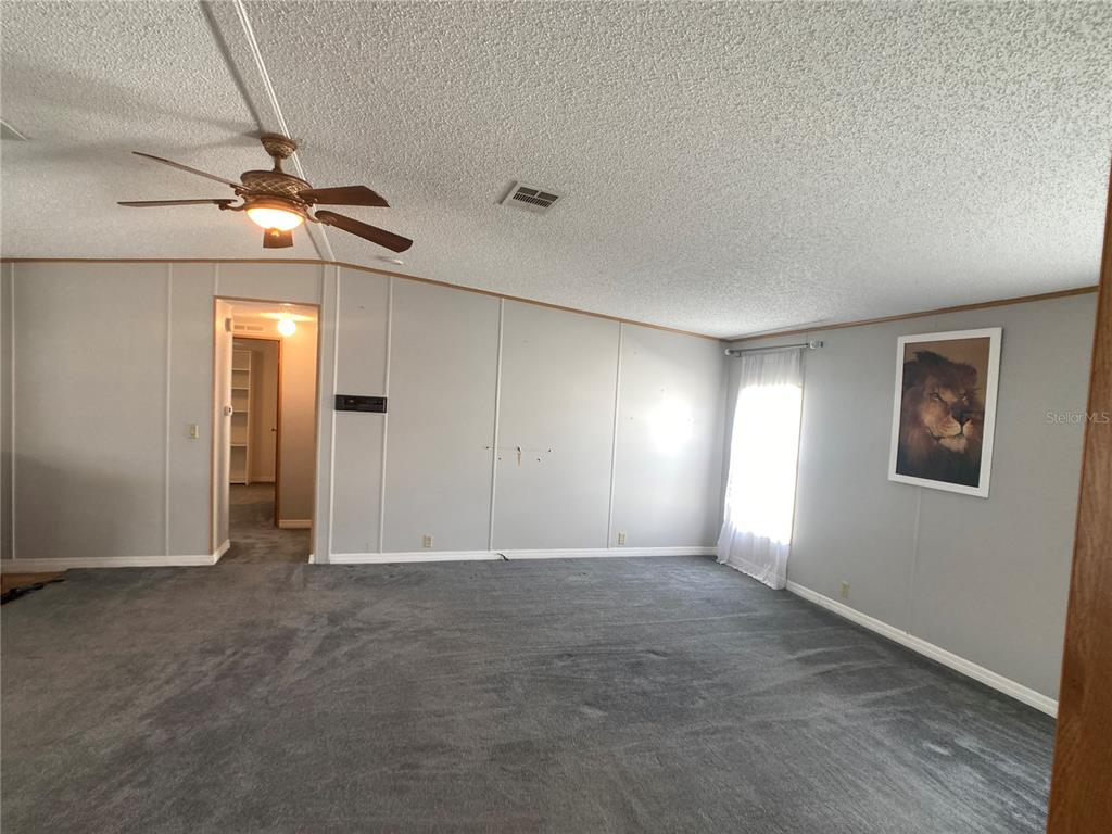 1710 7th Street Southwest, Unit 85 Ruskin, FL 33570 - Photo 13 of 28 a view of an empty room with a window