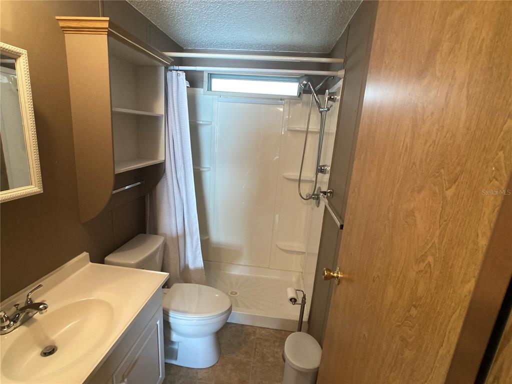 1710 7th Street Southwest, Unit 85 Ruskin, FL 33570 - Photo 24 of 28 a bathroom with a sink toilet and shower