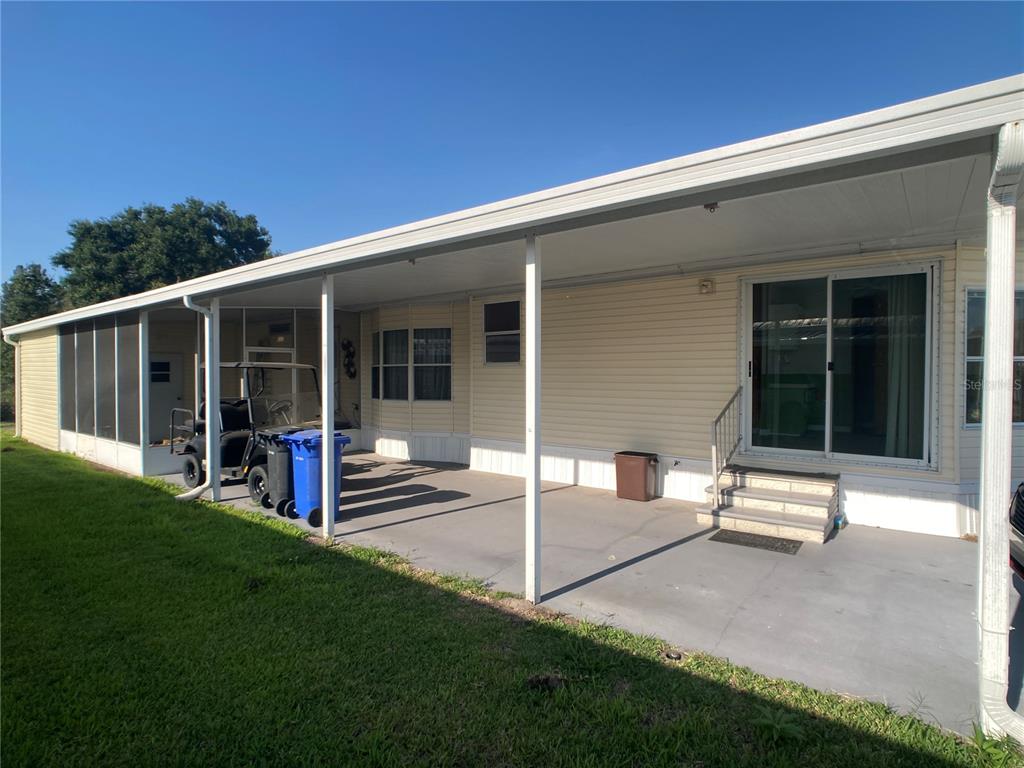 1710 7th Street Southwest, Unit 85 Ruskin, FL 33570 - Photo 5 of 28 a view of a house with backyard and porch