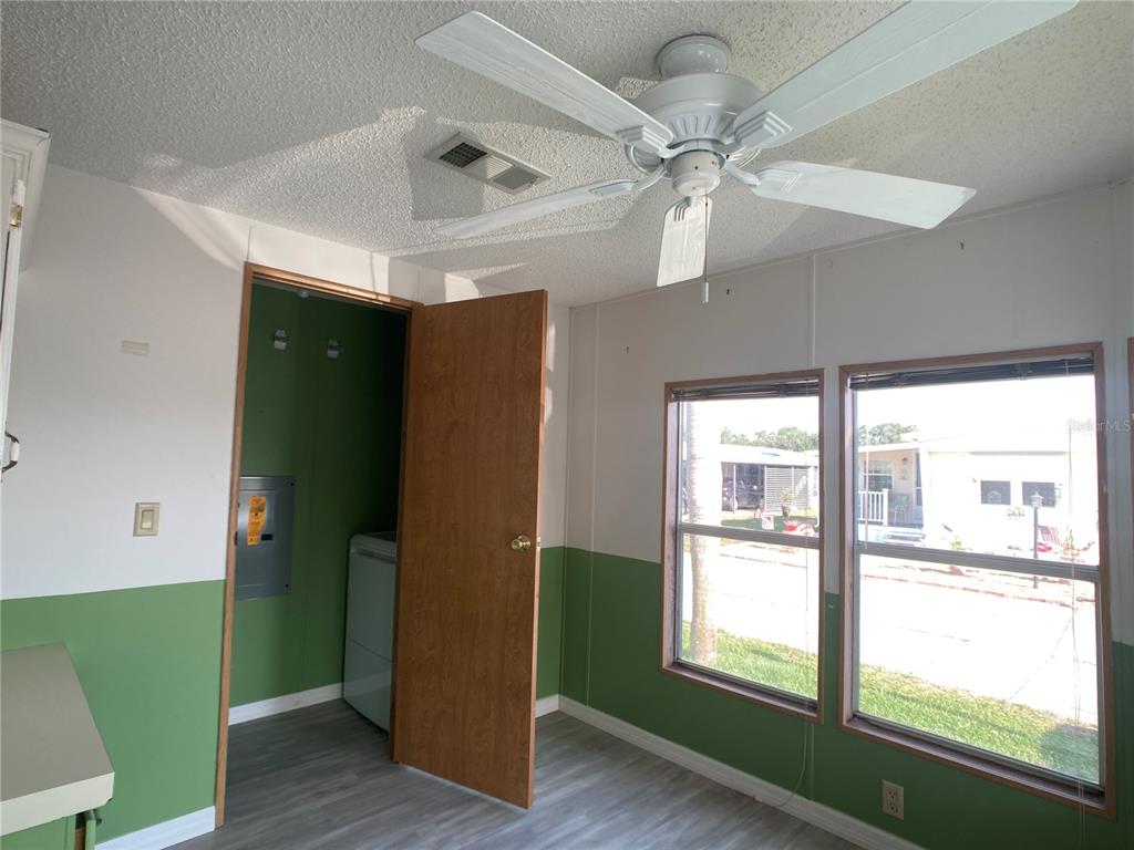 1710 7th Street Southwest, Unit 85 Ruskin, FL 33570 - Photo 6 of 28 a room with window and wooden floor
