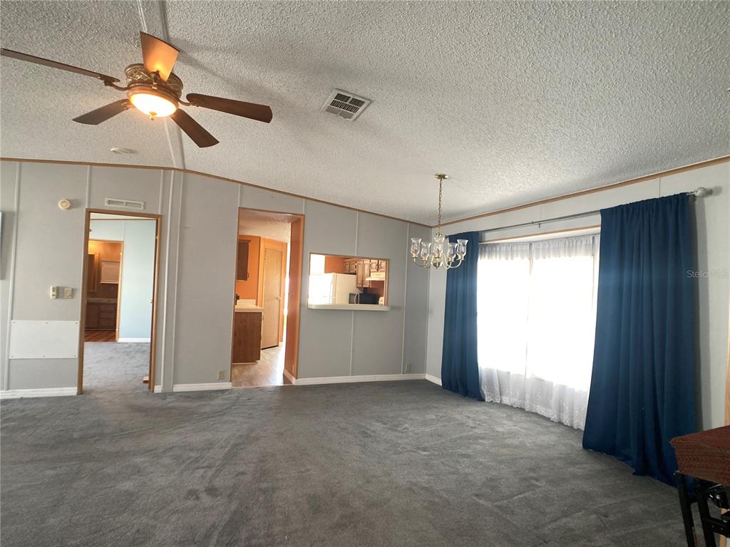 1710 7th Street Southwest, Unit 85 Ruskin, FL 33570 - Photo 10 of 28 a view of empty room with window and ceiling fan