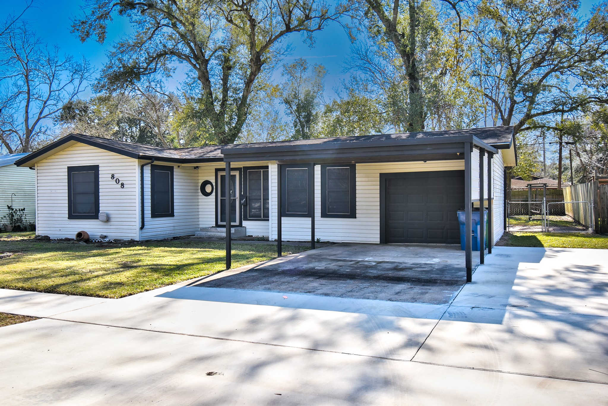 808 Akers Street Angleton, TX 77515 - Photo 11 of 11 a view of a house with a yard and large tree