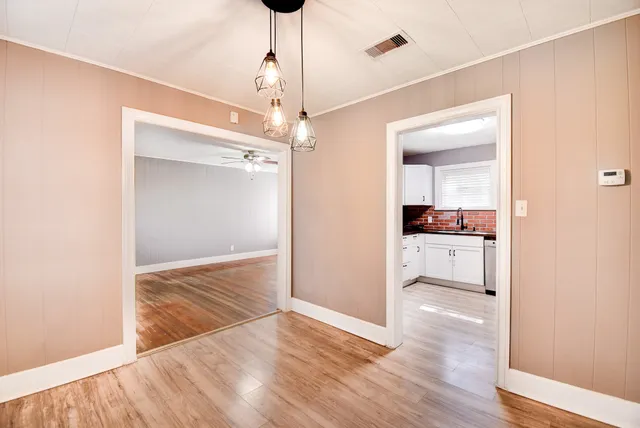 a view of a kitchen cabinets and wooden floor
