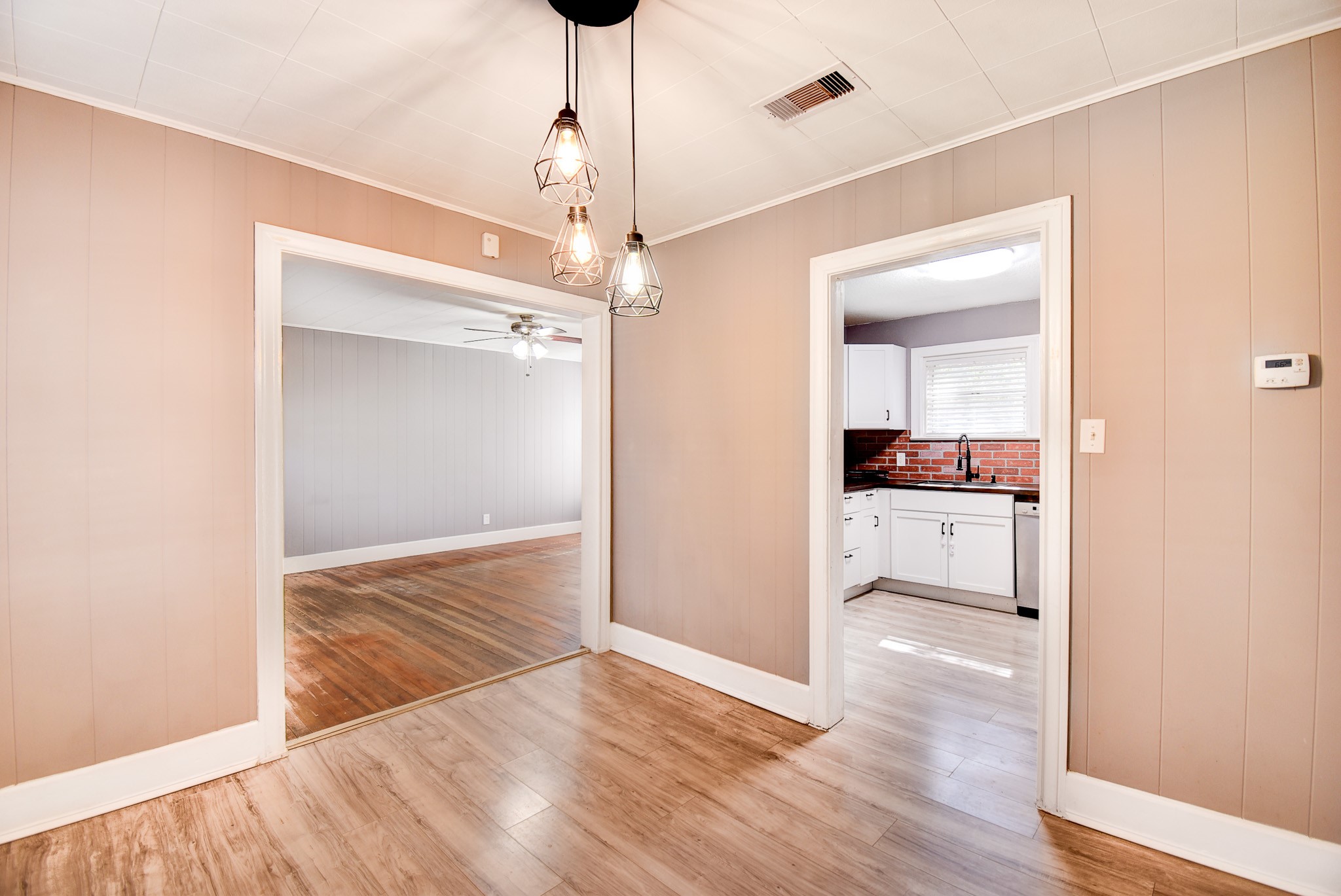 808 Akers Street Angleton, TX 77515 - Photo 3 of 11 a view of a kitchen cabinets and wooden floor