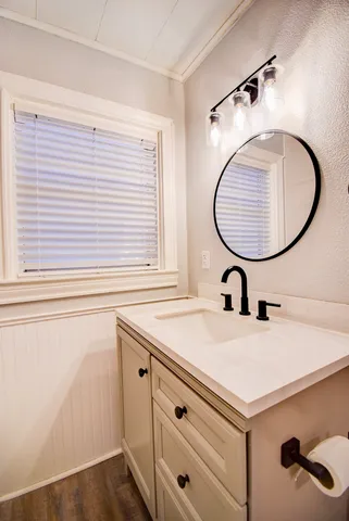 a bathroom with a sink and a mirror
