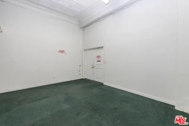 a view of empty room with stairs