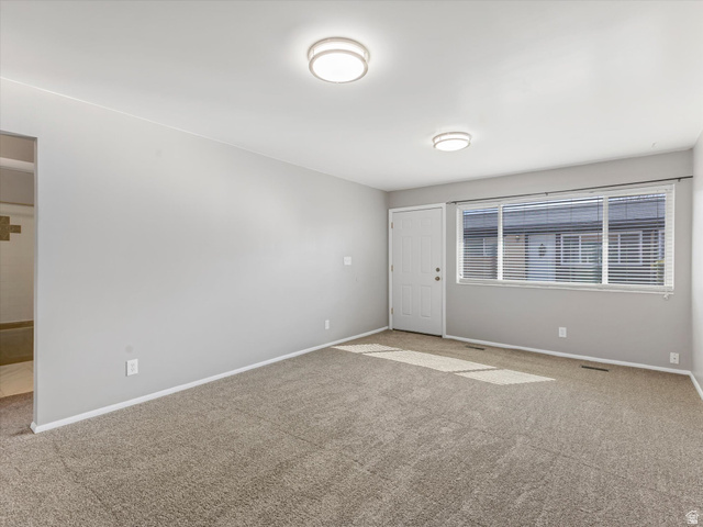 1478 North 75 West, Unit AD Sunset, UT 84015 - Photo 10 of 26 Carpeted spare room with baseboards