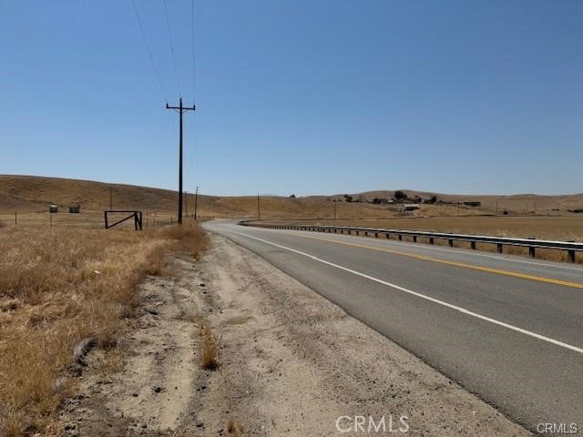 13300 Round Mountain Road Bakersfield, CA 93308 - Photo 10 of 13 a view of an empty room with wooden floor