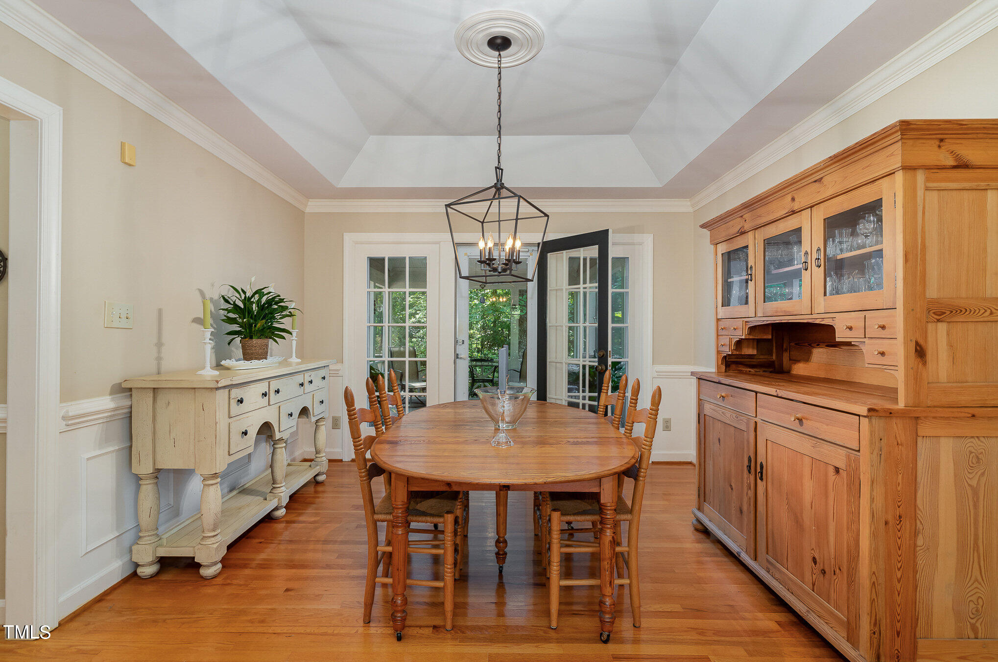 109 Lochfield Drive Cary, NC 27518 - Photo 11 of 43 a kitchen with kitchen island granite countertop a dining table chairs and white cabinets