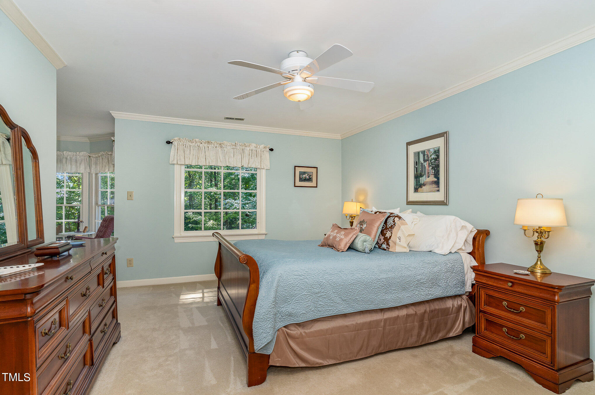109 Lochfield Drive Cary, NC 27518 - Photo 20 of 43 a bedroom with a bed and dresser with chair