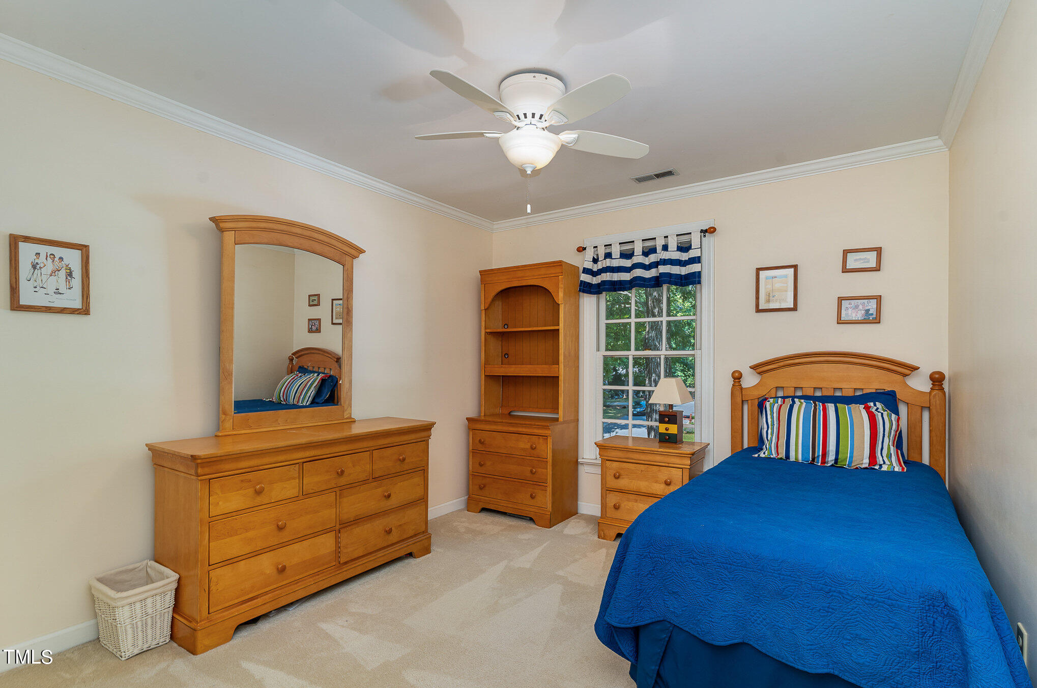 109 Lochfield Drive Cary, NC 27518 - Photo 25 of 43 a bedroom with a bed and a chandelier
