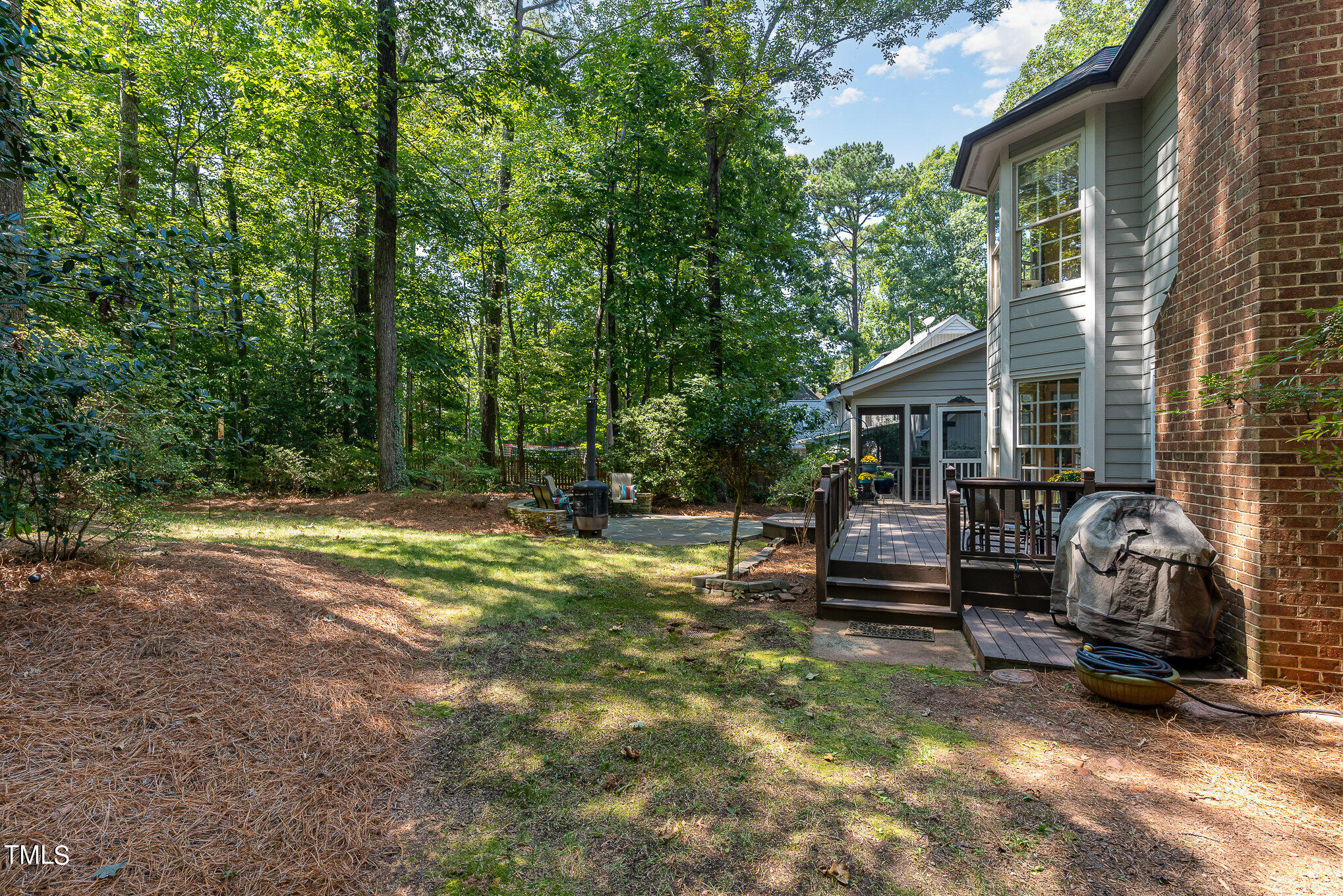 109 Lochfield Drive Cary, NC 27518 - Photo 32 of 43 a view of a house with backyard and sitting area