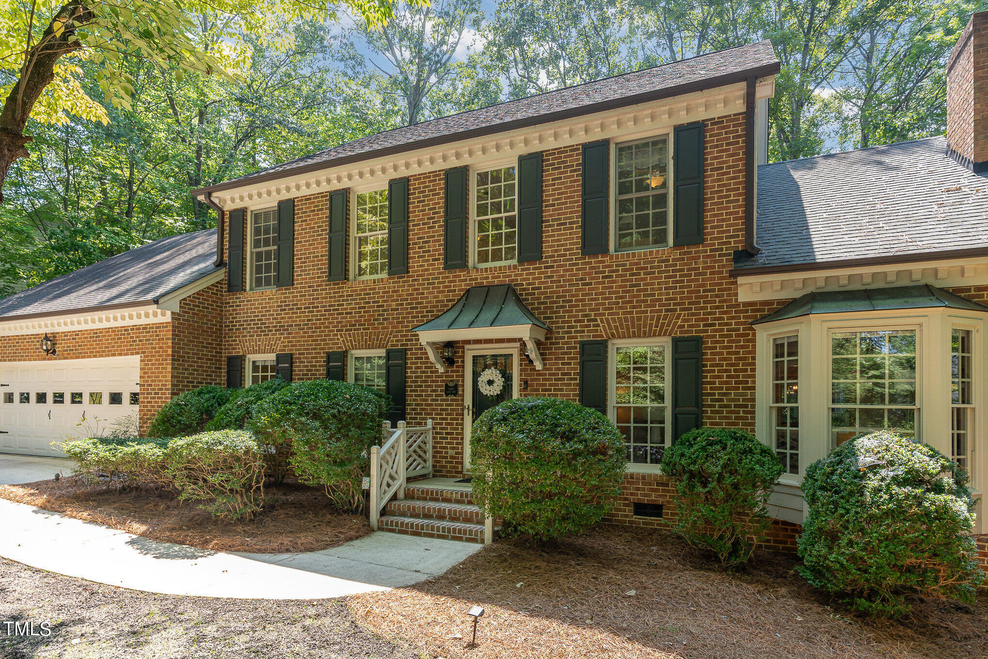 109 Lochfield Drive Cary, NC 27518 - Photo 35 of 43 a front view of a house with garden