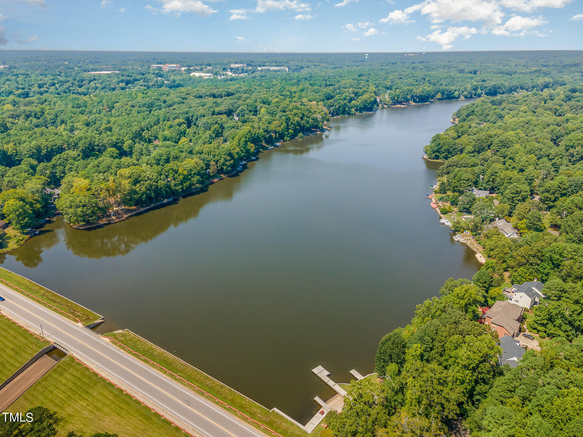 109 Lochfield Drive Cary, NC 27518 - Photo 40 of 43 a view of a lake with a mountain in the background