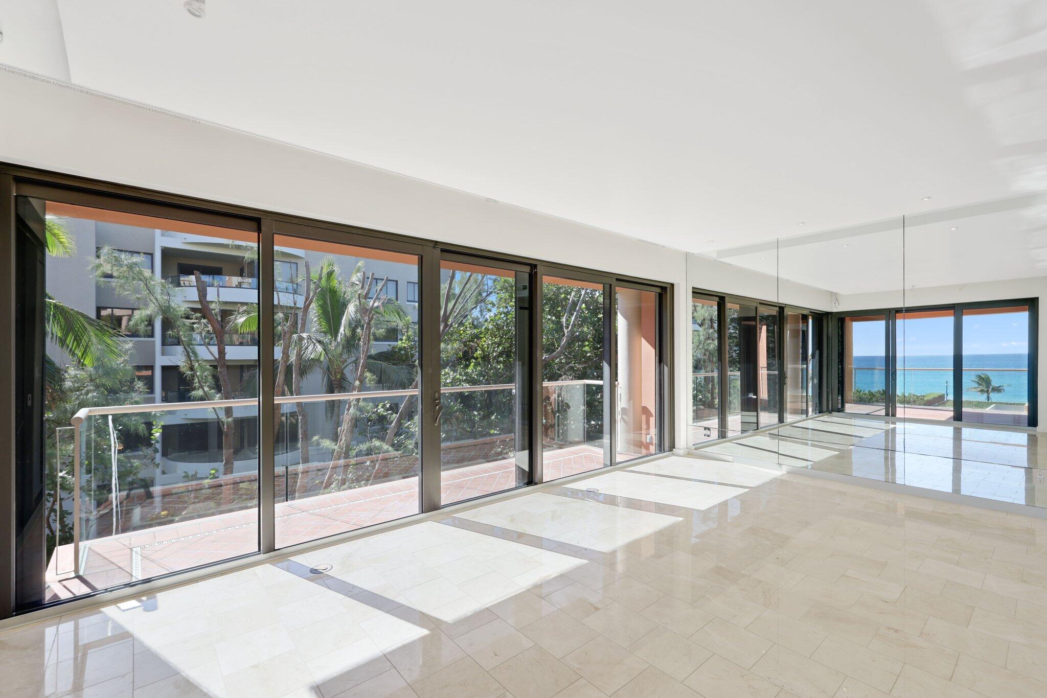 2 North Breakers Row, Unit S32 Palm Beach, FL 33480 - Photo 20 of 77 a view of a room with sliding glass door and mountain view