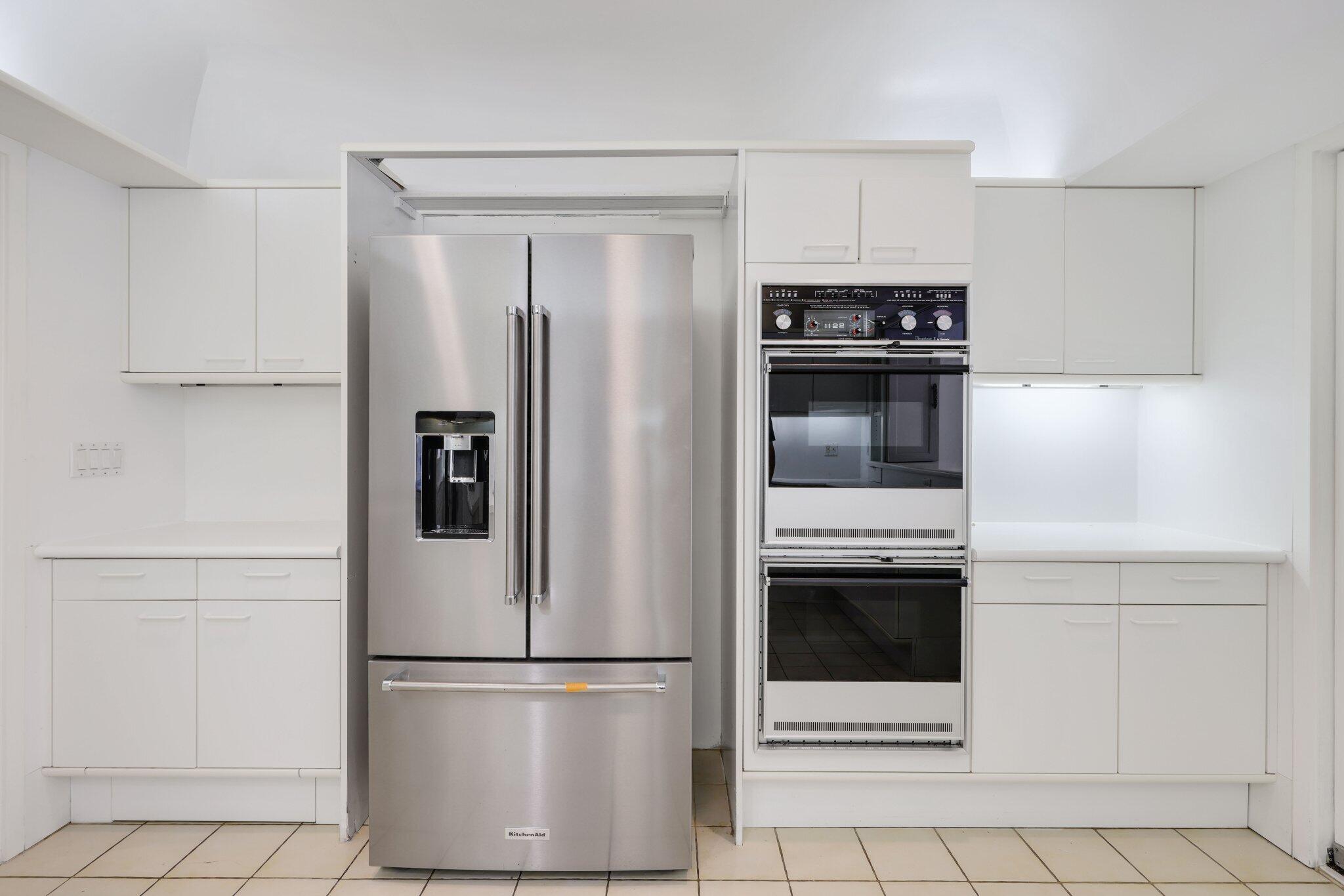 2 North Breakers Row, Unit S32 Palm Beach, FL 33480 - Photo 32 of 77 a white refrigerator freezer and a stove in a kitchen
