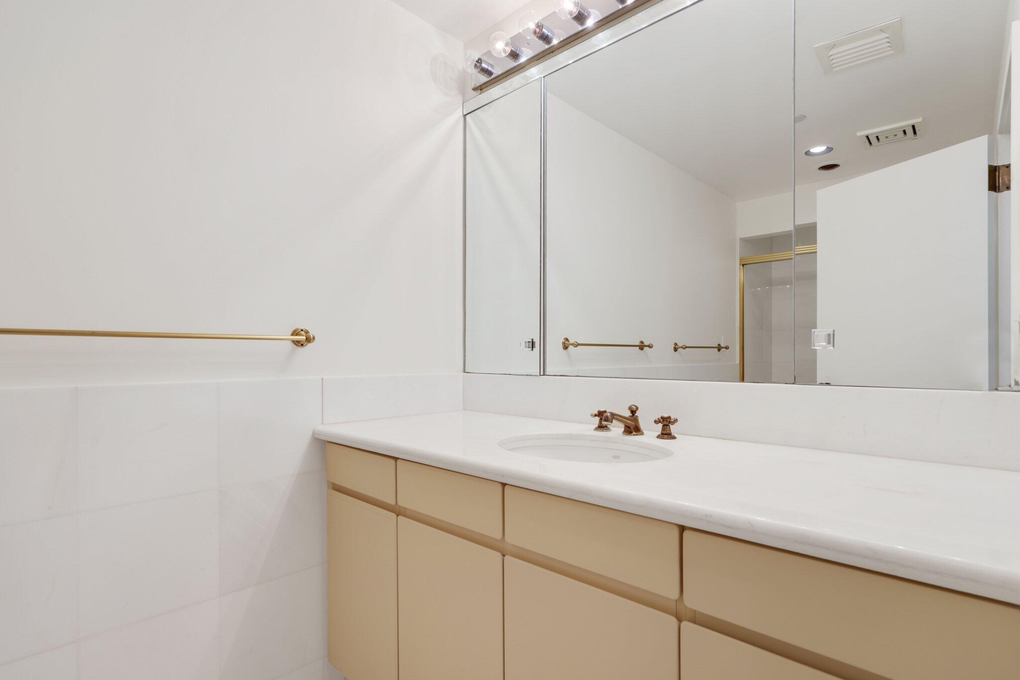 2 North Breakers Row, Unit S32 Palm Beach, FL 33480 - Photo 39 of 77 a bathroom with a sink and a mirror