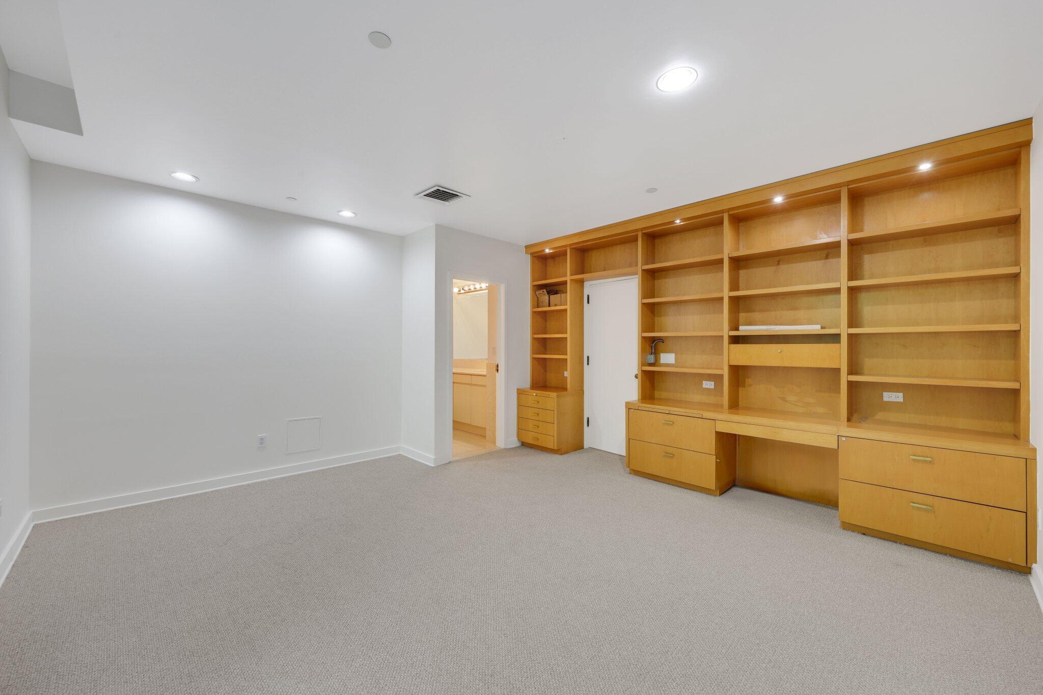 2 North Breakers Row, Unit S32 Palm Beach, FL 33480 - Photo 43 of 77 a view of an empty room with a cabinet and mirrors